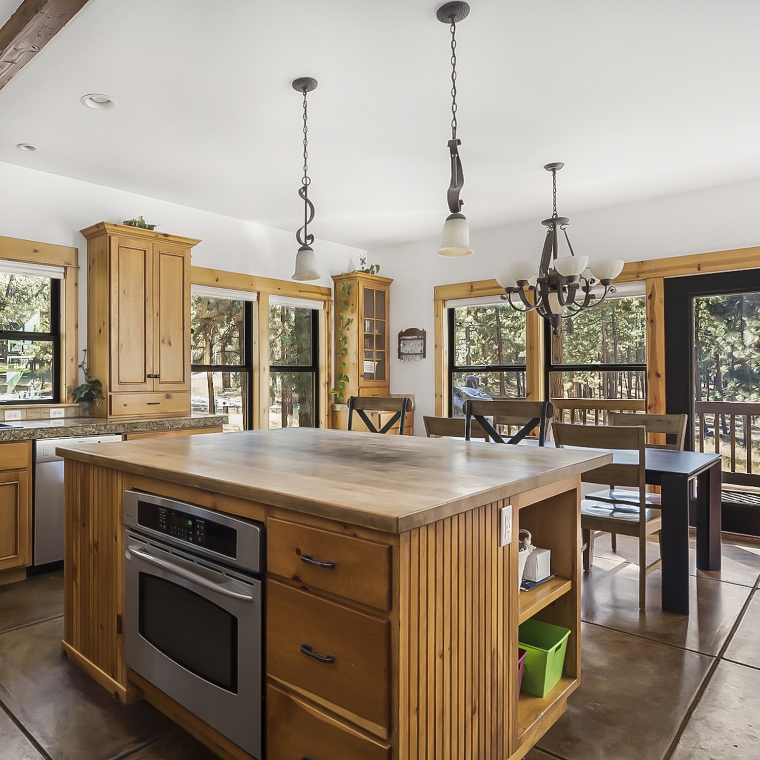 Kitchen and dining room with wood-trimmed windows